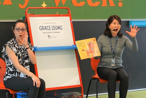 City Manager Grace Leung reading at storytime