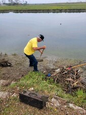 Photo of Trellis member working at cleanup site