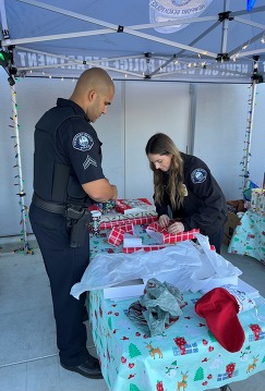 Photo of Officers wrapping gifts