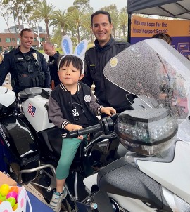 Image of a child on a police motorcycle bike