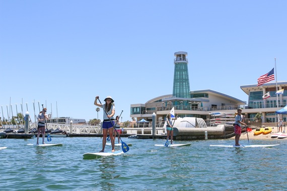 Image of students paddleboarding in Marina Park