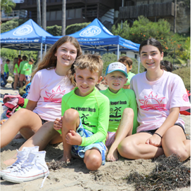 photo of teen leaders with camp children