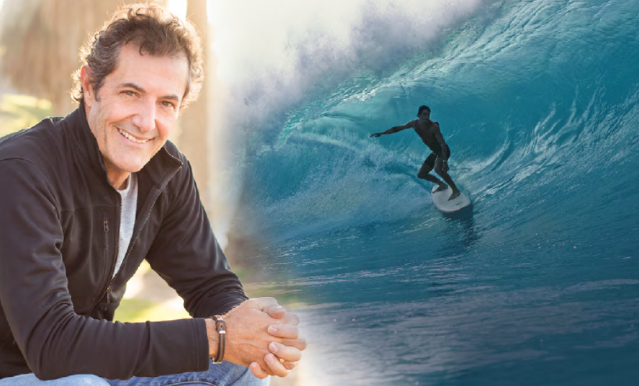 Surf legend Shaun Tomson in front of a wave