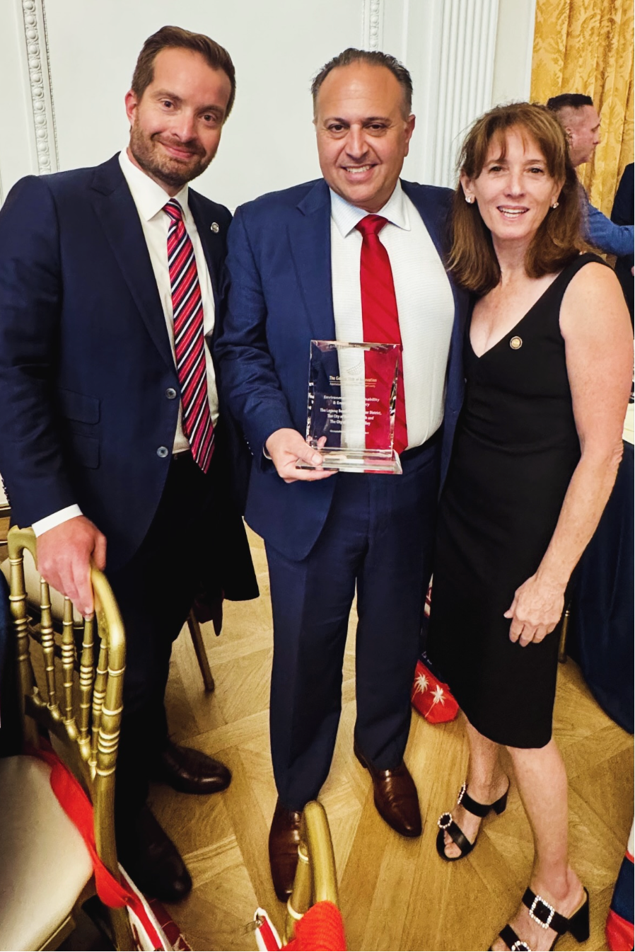 councilmembers and city manager receiving golden hub award