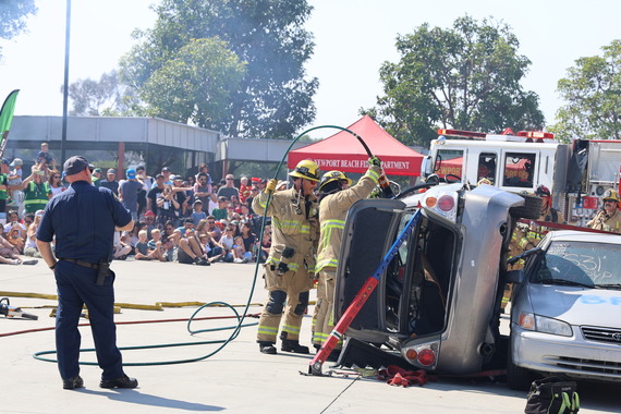 Fire Service Day demo on how to pry open car door on its side