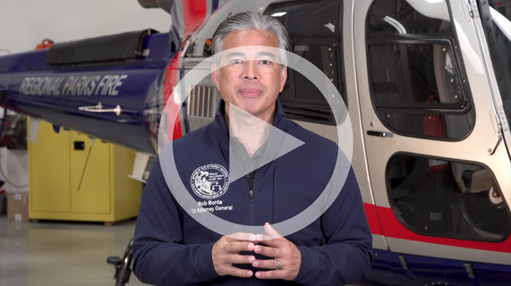 Image of AG in front of helicopter 