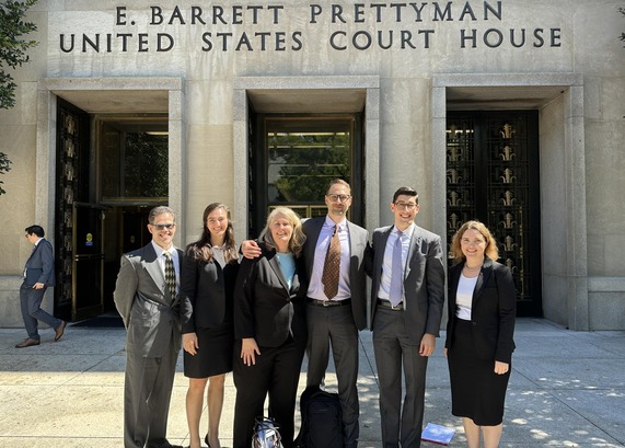 DOJ lawyers on steps of courthouse