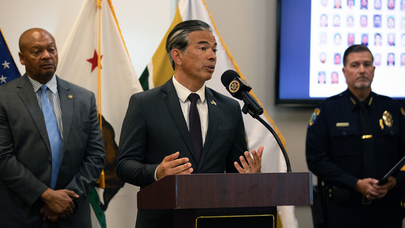 Picture of Attorney General Bonta speaking at press conference in Merced, with law enforcement officials 