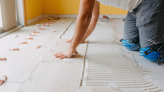 Contractor Laying Tile