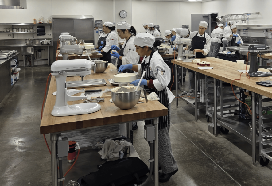 OCC student chefs working on their cakes for class