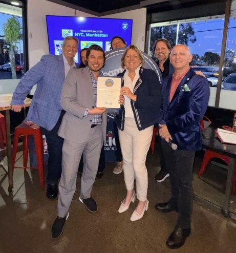 presenting the Certificate of Recognition to Team Kids