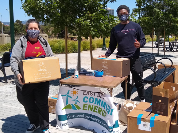 EBCE staff member handing out masks