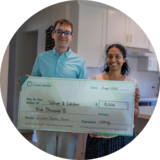 William and Lakshmi, Sunnyvale residents, holding a check