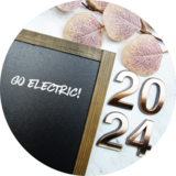 "2024" decorations with chalkboard that says Go Electric