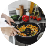 an image of a person making food on an induction cooktop
