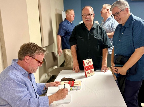 Bill Pugin signing books