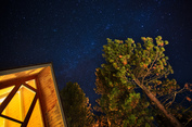 Forest cabin at night