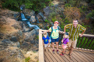 Photo of a family standing on the observation deck at hidden falls. 