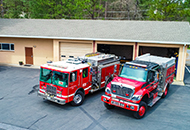 Photos of two fire engines outside a fire station. 