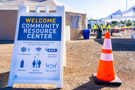A-frame sign reading Community Resource Center at a Pacific Gas and Electric Company charging station opened during a public safety power shutoff