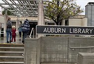 People walking into the library