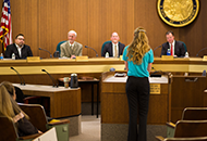 Board of supervisors meeting with someone making public comment