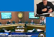 A woman talking to the board of supervisors through a video call