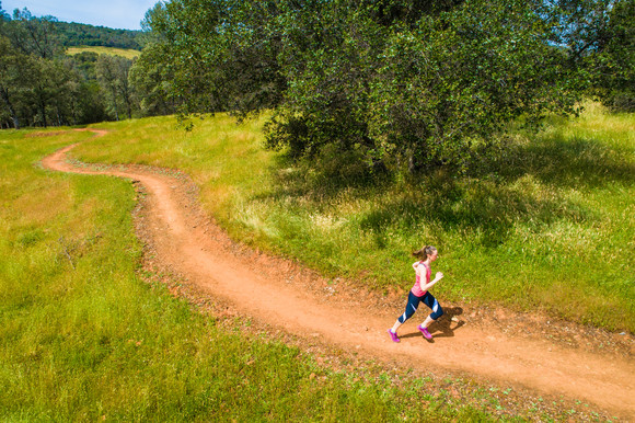 woman running on singletrack 