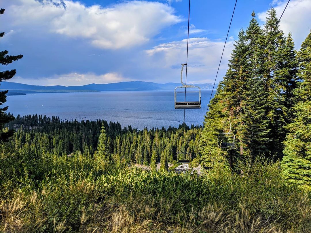 Photo of a ski lift overlooking a lake. 