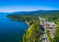 Aerial photograph of blue Lake Tahoe and its Tahoe City lake shore