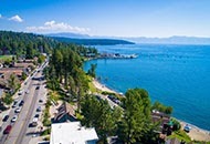 Lake Tahoe, beautiful blue sky with fluffy clouds, and the view of a crispy blue lake