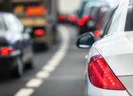 cars lined up together on road