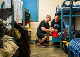 two men in a homeless shelter
