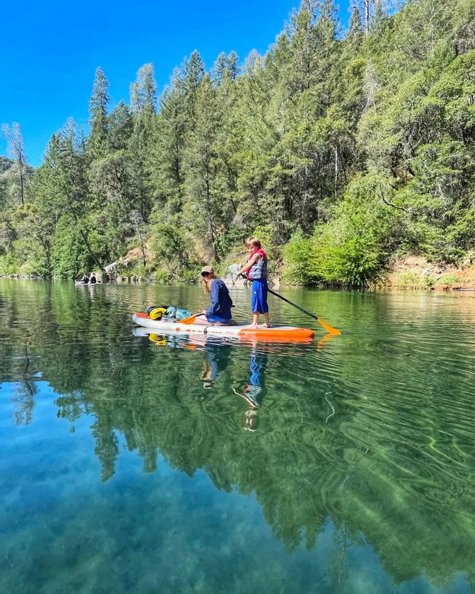 mother and son on paddle board