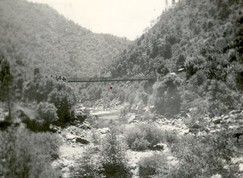 old black and white photo of Yankee Jims bridge over river