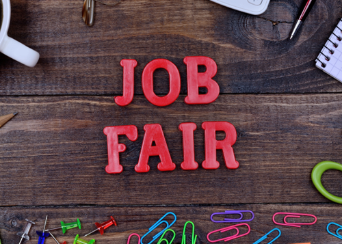 red Job Fair text on wood background