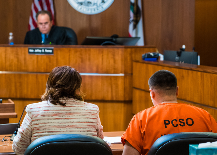 Defendant sits with their lawyer in the Placer County Superior Court of California