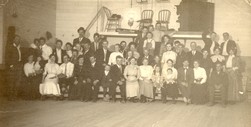 Historical photo of community members at a dance hall