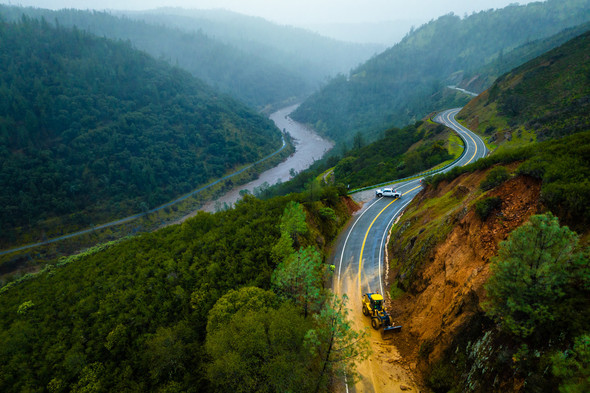 Road crew clears a road blocked by an avalanche