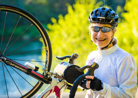 Elderly woman riding a bike