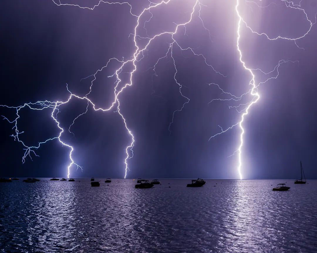 Lightning strikes over Lake Tahoe water during the night