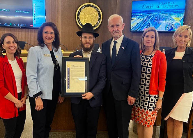 Board of Supervisors with Rabbi Yossi Korik holding a proclamation in support of Israel