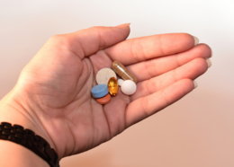 Hand holds variety of medications