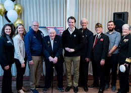 The Board of Supervisors and other local dignitaries pose with Navy veteran Dominic Canale on his 100th birthday
