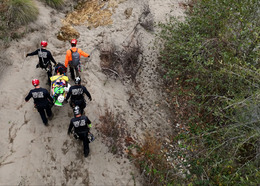 Placer County rescue teams practice carrying a fallen hiker for a training simulation