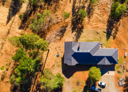 Aerial view of a home with defensible space