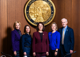 Placer County Board of Supervisors pose in front of county seal