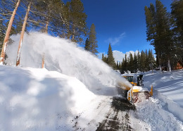 Snow blower clears snowy road in Tahoe