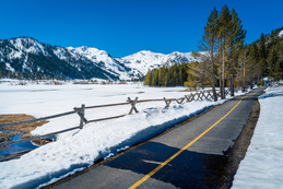 A bike path through the snow of Olympic Valley park.