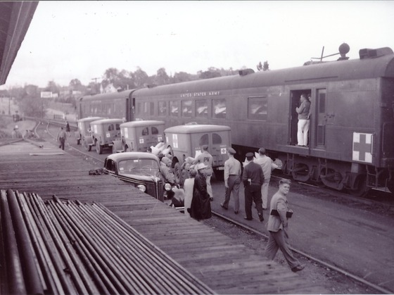 Men at a train during WWII